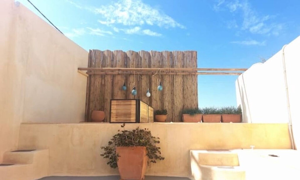 Oia Apartment | Casa Itaca Fireplace Cave Apartment with Private Jacuzzi in Oia, Finikia