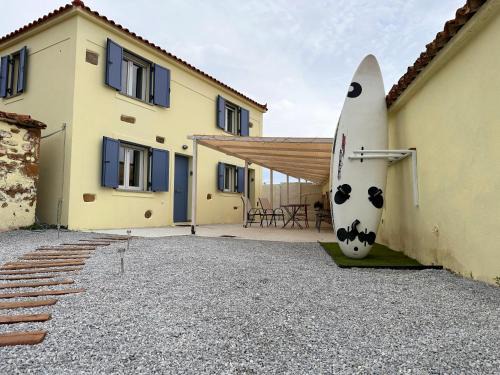 Lemnos House | Surf-themed stone house at Kalliopi