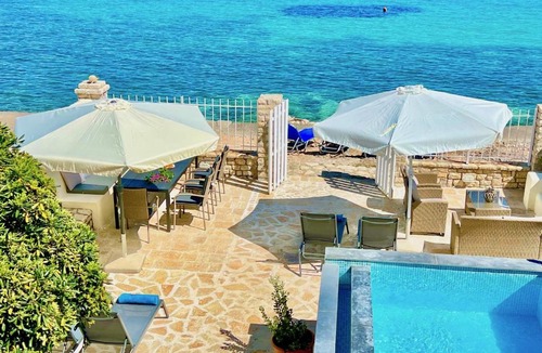 Kassiopi Villa | Beachfront House Christina with private heatable pool by DadoVillas