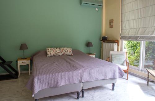 Argyroupoli Apartment | Charming Sunlit Apartment with Garden Views