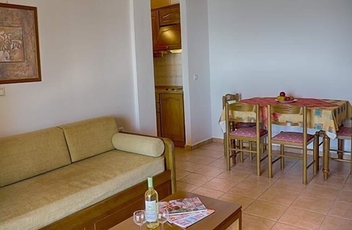 Agios Georgios Pagon Apartment | Maria's apartment 1 - right on the beach with sea views in the beautiful bay of Agios Georgios Pago