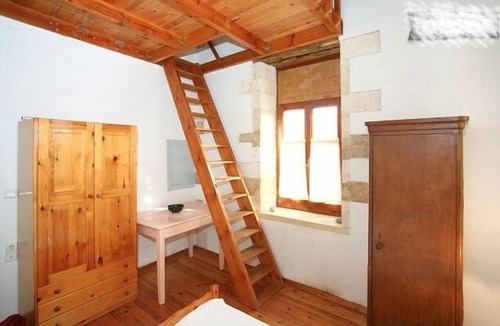 Chania Old City House | Old Town Chania · 500-year-old Venetian house for 6 · vine-covered courtyard