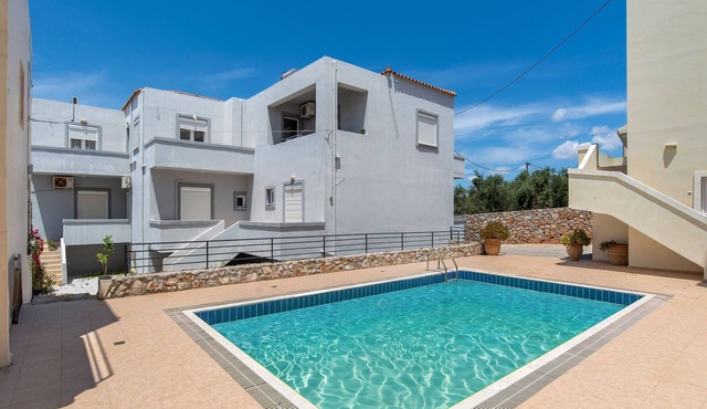 A house in Almyrida with a communal pool