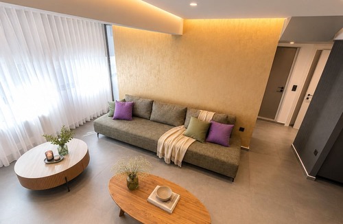 Koukaki Villa | Gold & Concrete Acropolis Residence
