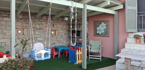 Agia Triada Villa | Villa Sunset with stunning sea view, kids area and hammocks on roof terrace